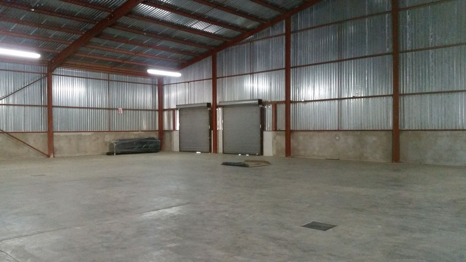 Warehouse loading area with roll-up doors